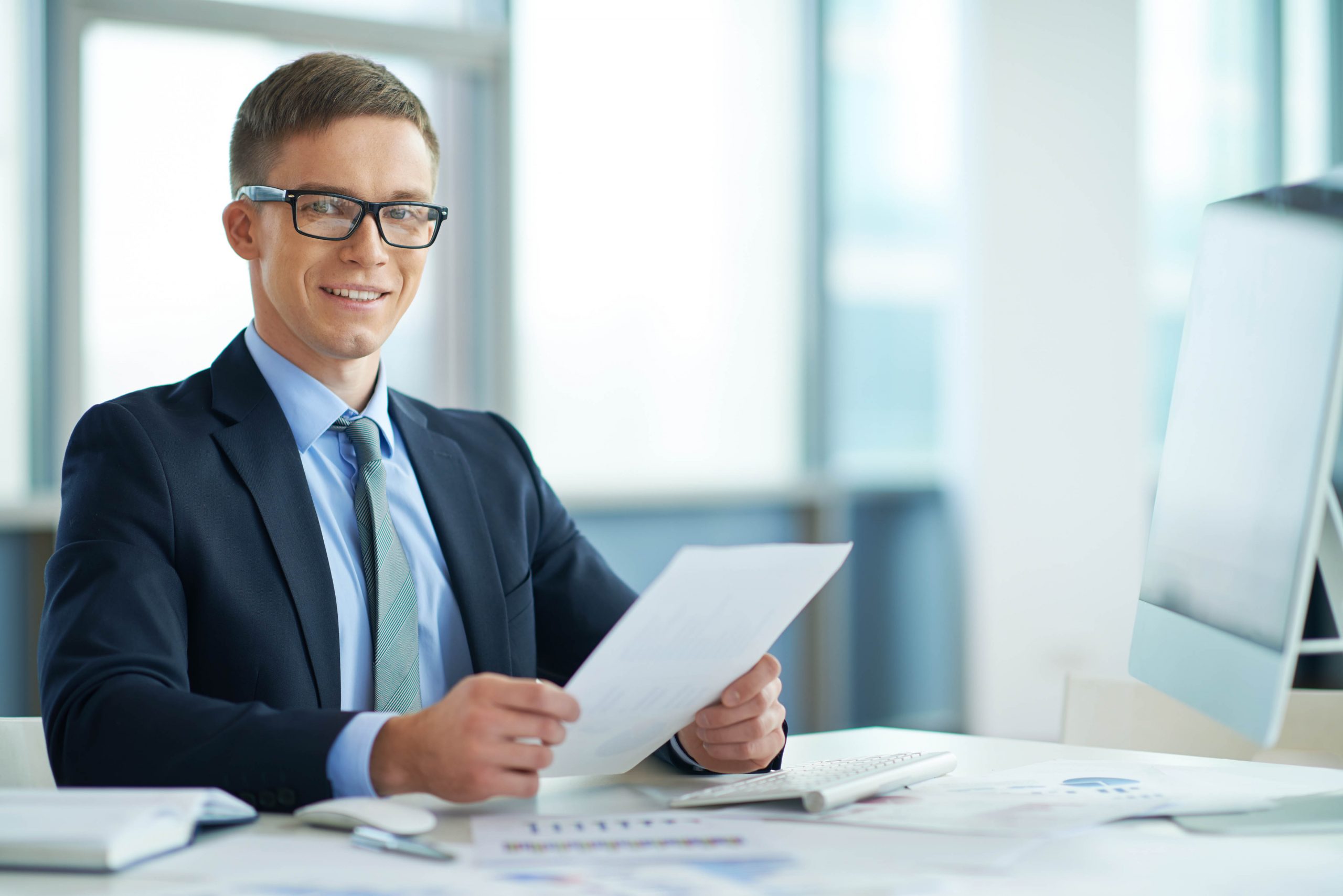 Portrait of a young manager at his workplace